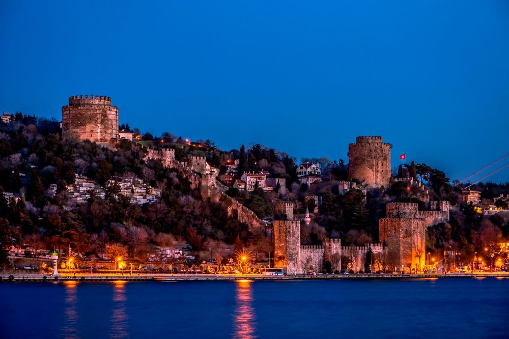 Wide-angle view of Rumeli Fortress walls and towers along the Bosphorus coastline